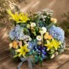 Premium blue hydrangea and orchid floral basket arrangement for online flower delivery in Bangalore.