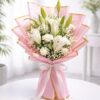 White lily bouquet with baby’s breath in blush pink luxury wrapping for flower delivery Bangalore
