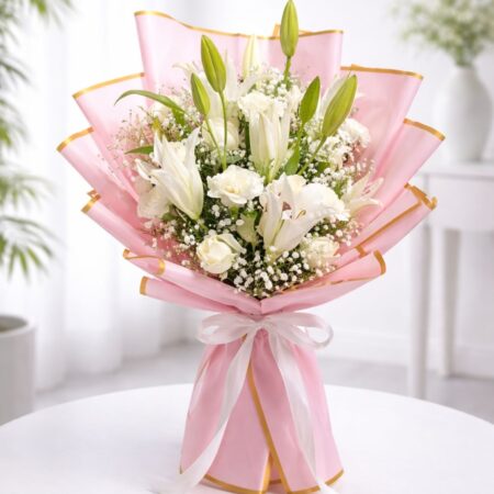 White lily bouquet with baby’s breath in blush pink luxury wrapping for flower delivery Bangalore