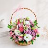 Pastel flower basket with pink carnations white eustoma online flower delivery India