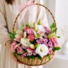 Pastel flower basket with pink carnations white eustoma online flower delivery India