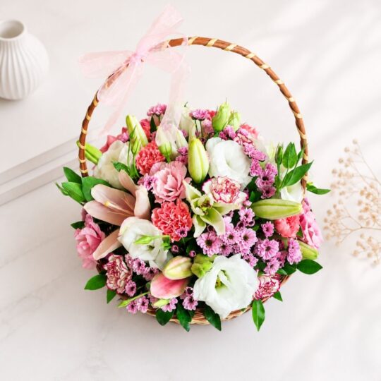 Pastel flower basket with pink carnations white eustoma online flower delivery India