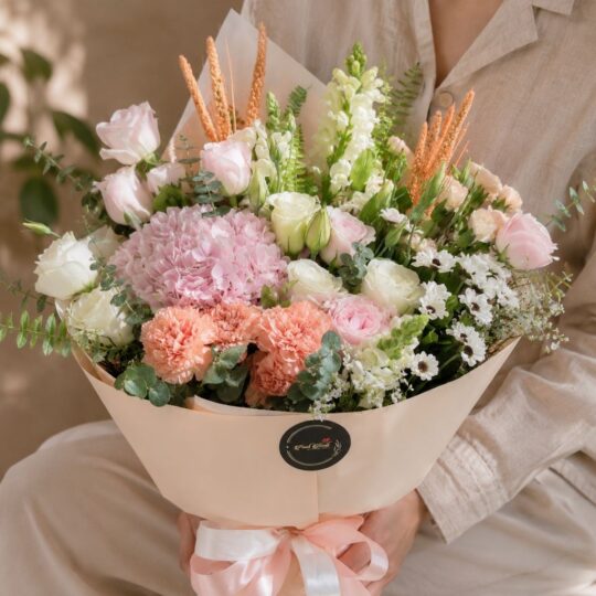 Luxury peach and blush flower bouquet with premium seasonal blooms and elegant wrapping for online flower delivery in Bangalore.