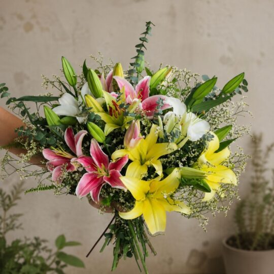 Luxury lily bouquet with seasonal flowers in elegant hand tied wrapping for online flower delivery in Bangalore.