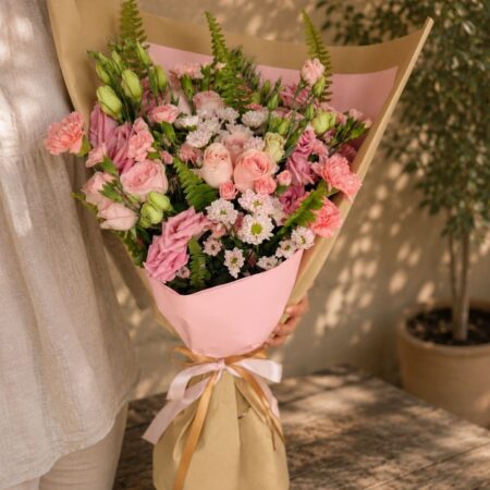 Premium European style pink flower bouquet with roses, carnations, eustoma and seasonal blooms by FreshKnots Bangalore.