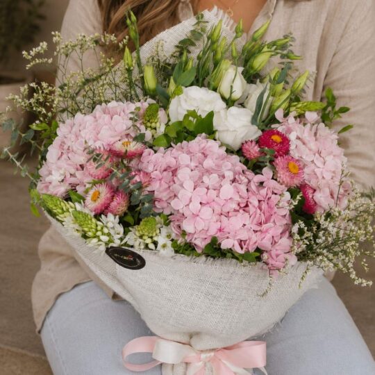 Luxury pink hydrangea bouquet with seasonal flowers and earthy minimalist wrapping for online flower delivery in Bangalore.