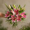 Premium pink lily bouquet with seasonal flowers and earthy wrapping for online flower delivery in Bangalore.