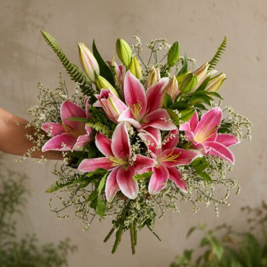 Premium pink lily bouquet with seasonal flowers and earthy wrapping for online flower delivery in Bangalore.