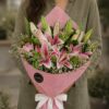 Premium pink lily bouquet with seasonal flowers and earthy wrapping for online flower delivery in Bangalore.