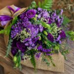 Luxury European style purple flower bouquet with lisianthus, asters, seasonal blooms and rustic wrapping by FreshKnots Bangalore. Available for online flowers delivery in Bangalore.