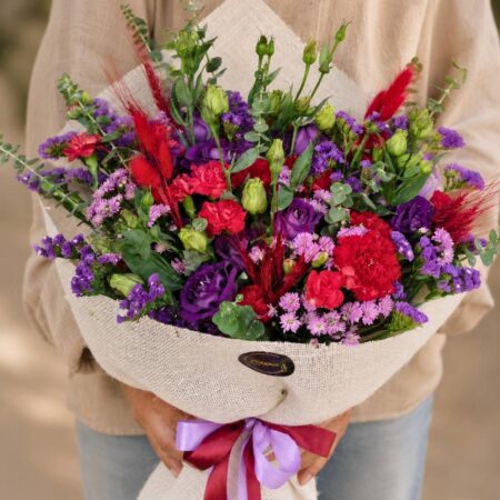 Premium pink and purple flower bouquet with seasonal blooms and elegant wrapping for online flower delivery in Bangalore.