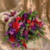 Premium pink and purple flower bouquet with seasonal blooms and elegant wrapping for online flower delivery in Bangalore.