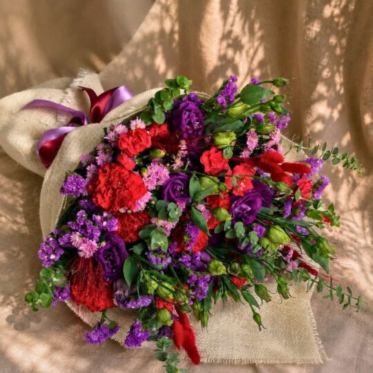 Premium pink and purple flower bouquet with seasonal blooms and elegant wrapping for online flower delivery in Bangalore.