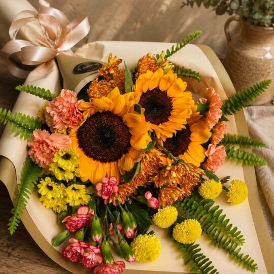 Luxury sunflower bouquet in European hand tied style with seasonal flowers and greenery by FreshKnots Bangalore. for Same Day delivery