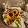 Luxury sunflower bouquet in European hand tied style with seasonal flowers and greenery by FreshKnots Bangalore. for Same Day delivery