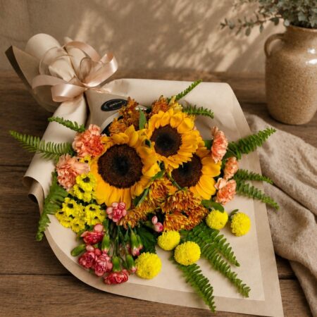 Luxury sunflower bouquet in European hand tied style with seasonal flowers and greenery by FreshKnots Bangalore. for Same Day delivery