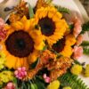 Luxury sunflower bouquet in European hand tied style with seasonal flowers and greenery by FreshKnots Bangalore. for Same Day delivery