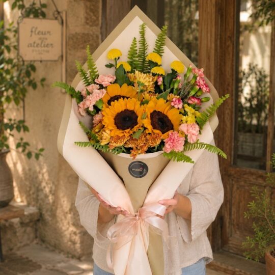 Luxury sunflower bouquet in European hand tied style with seasonal flowers and greenery by FreshKnots Bangalore. for Same Day delivery