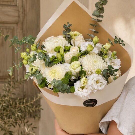 Elegant white flower bouquet with premium seasonal blooms and earthy minimalist wrapping for online flower delivery in Bangalore.