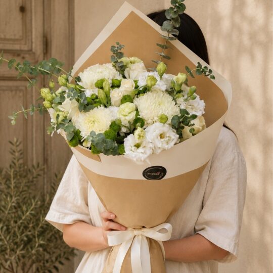Elegant white flower bouquet with premium seasonal blooms and earthy minimalist wrapping for online flower delivery in Bangalore.