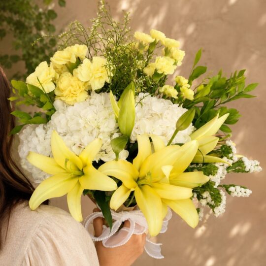 Premium European style bouquet with yellow lilies, white hydrangeas and seasonal flowers by FreshKnots Bangalore.