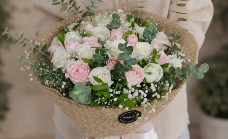 Premium pink and white rose bouquet with eucalyptus for online flower delivery in Bangalore.