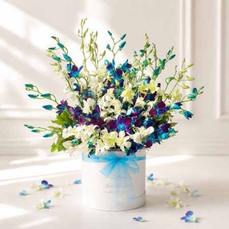 Luxury white and blue orchid hat box arrangement by FreshKnots for premium flower delivery in Bangalore.