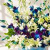 Luxury white and blue orchid hat box arrangement by FreshKnots for premium flower delivery in Bangalore.