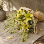 Premium yellow lily and white orchid bouquet for online flower delivery in Bangalore.