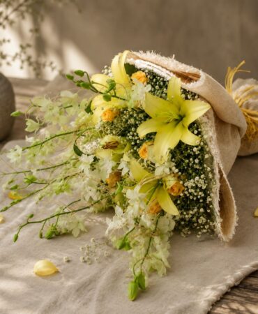 Premium yellow lily and white orchid bouquet for online flower delivery in Bangalore.