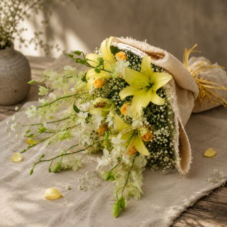 Premium yellow lily and white orchid bouquet for online flower delivery in Bangalore.