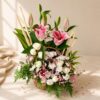 Close up of Willow and Bloom lily and rose basket arrangement, Bangalore flower delivery