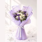 Premium bouquet of white roses, purple asters and baby's breath for same day flower delivery in Bangalore.