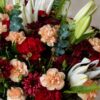 Close up of Chianti Muse burgundy carnations and white lilies, Bangalore flower delivery