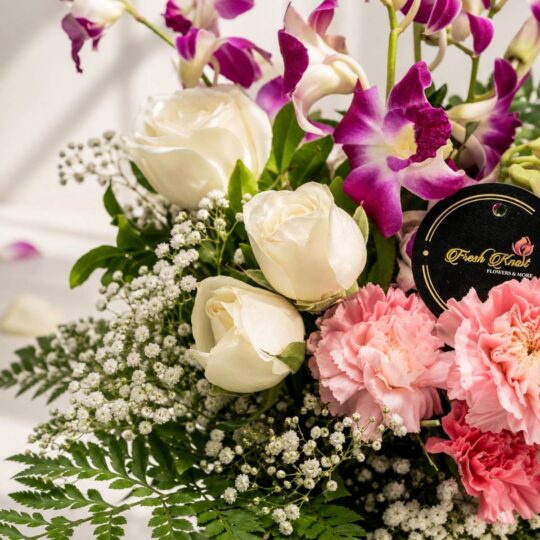 Close up of Joyful Blooms white roses and purple orchids, Bangalore flower delivery