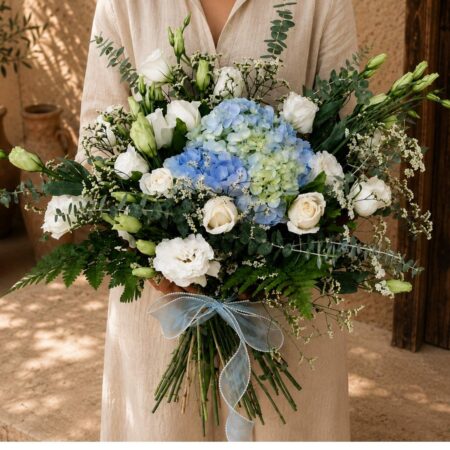 Mykonos Breeze white rose hydrangea bouquet held in hand, Bangalore