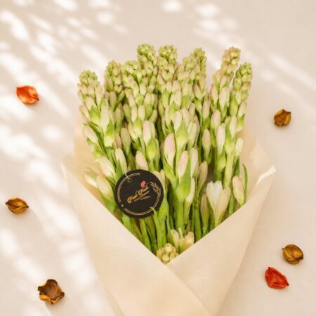 Tuberose stems wrapped in kraft paper, Bangalore flower delivery