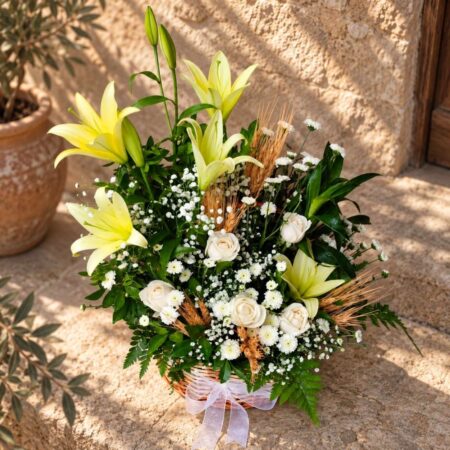 Close-up of lilies, roses and wheat, Castile Gold basket Bangalore