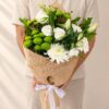 White and green mixed cut flowers bunch held, Bangalore