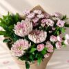 Pink mixed cut flowers, plain background Bangalore