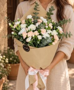 Sintra Pêche spray carnation bouquet in Bangalore with peach and white carnations and eucalyptus in kraft paper