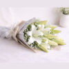 White lily bouquet lying flat, Words Left Unsaid Bangalore