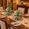 Two elephant candle holder flower centrepieces on mirror bases along a dining table runner