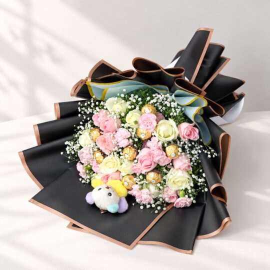 Rose and carnation bouquet with Ferrero Rocher and plush teddy lying flat, angled view