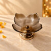 Amber textured glass lotus bowl on a polished gold metal pedestal stand, side view Title: Amber Lotus Urli Side View