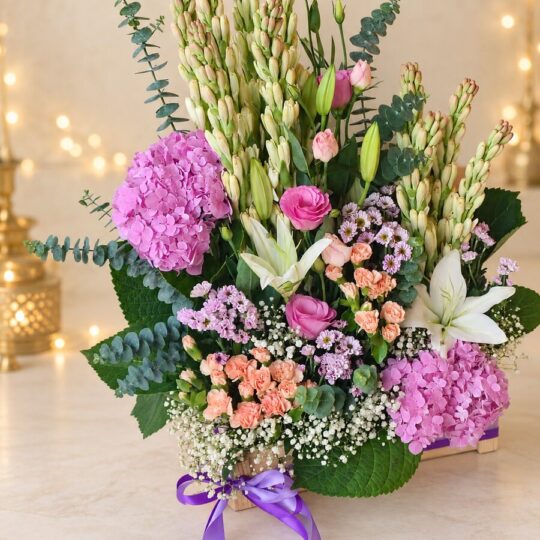 Tuberose, hydrangea and oriental lily arrangement with eucalyptus, angled view