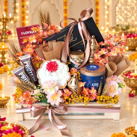 Diwali gourmet gift hamper in Bangalore with chocolates, 4700BC popcorn, makhana, protein bars, urli candle and gold lanterns in a wooden crate
