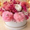Pink and white peony shaped candles with dried pink baby's breath, close-up