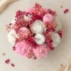 Peony candle flower box with pink and white candles and dried baby's breath, top view