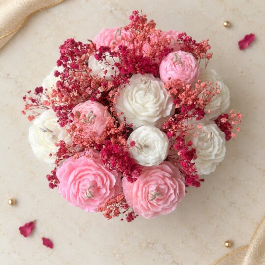 Peony candle flower box with pink and white candles and dried baby's breath, top view